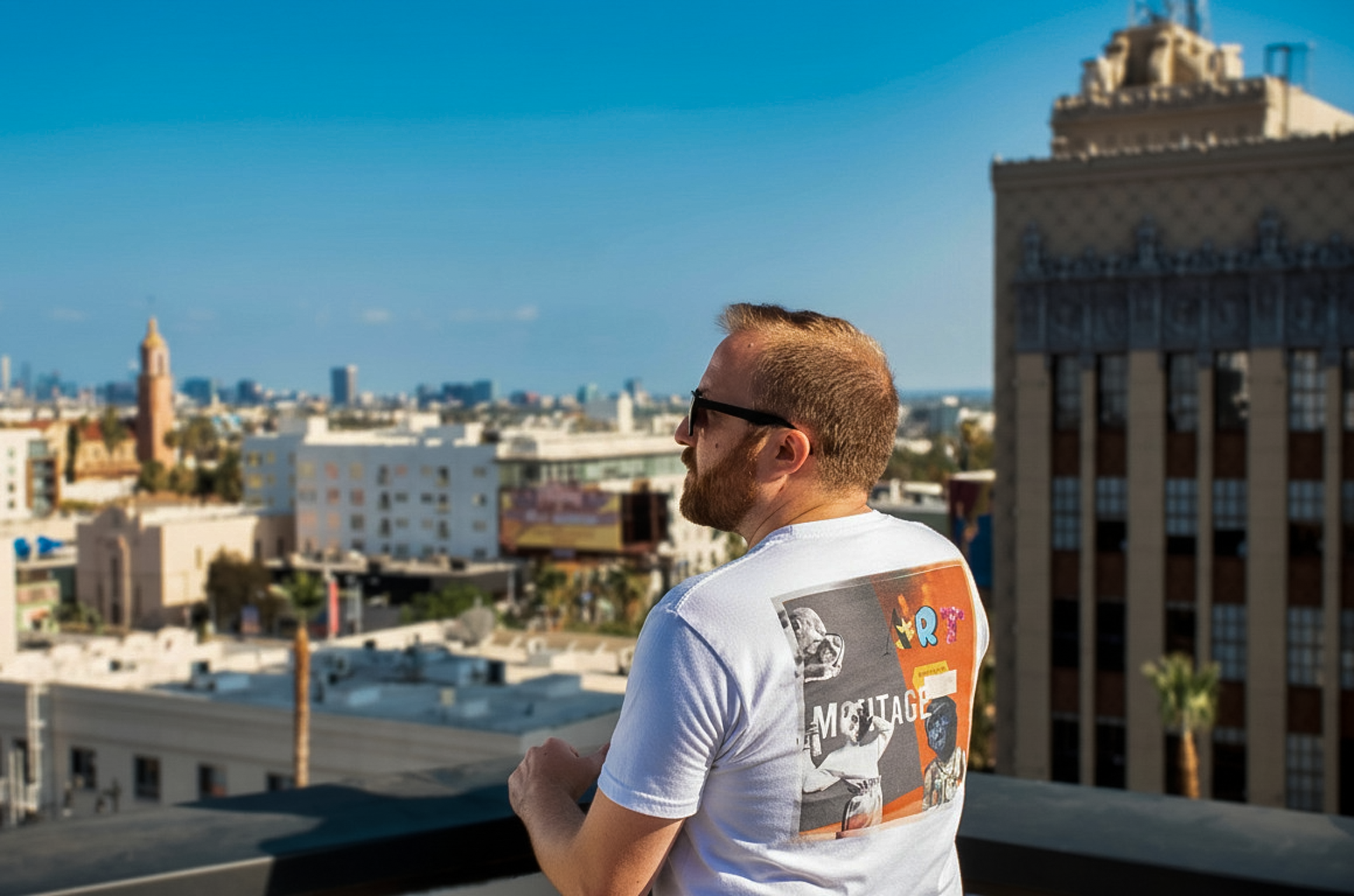 Montage Art Graphic T-Shirt — Retro Collage Art Tee with Small Heart Logo